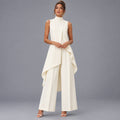 Woman wearing the ivory draped top and wide-leg pants set